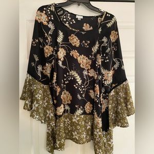 Ladies multi colored top size L asymmetrical hem and flowing sleeves
